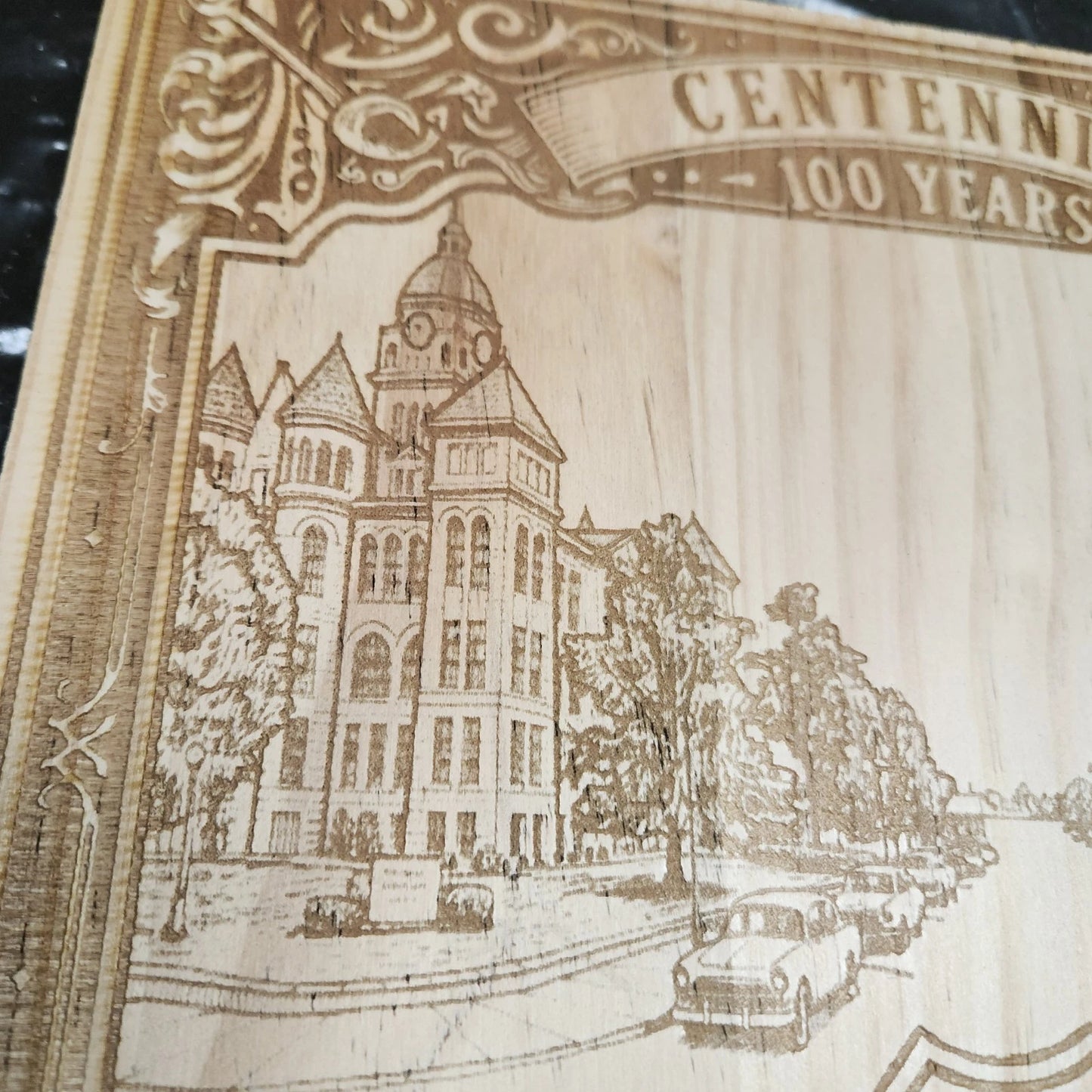 Close-up of Route 66 wood laser-engraved design