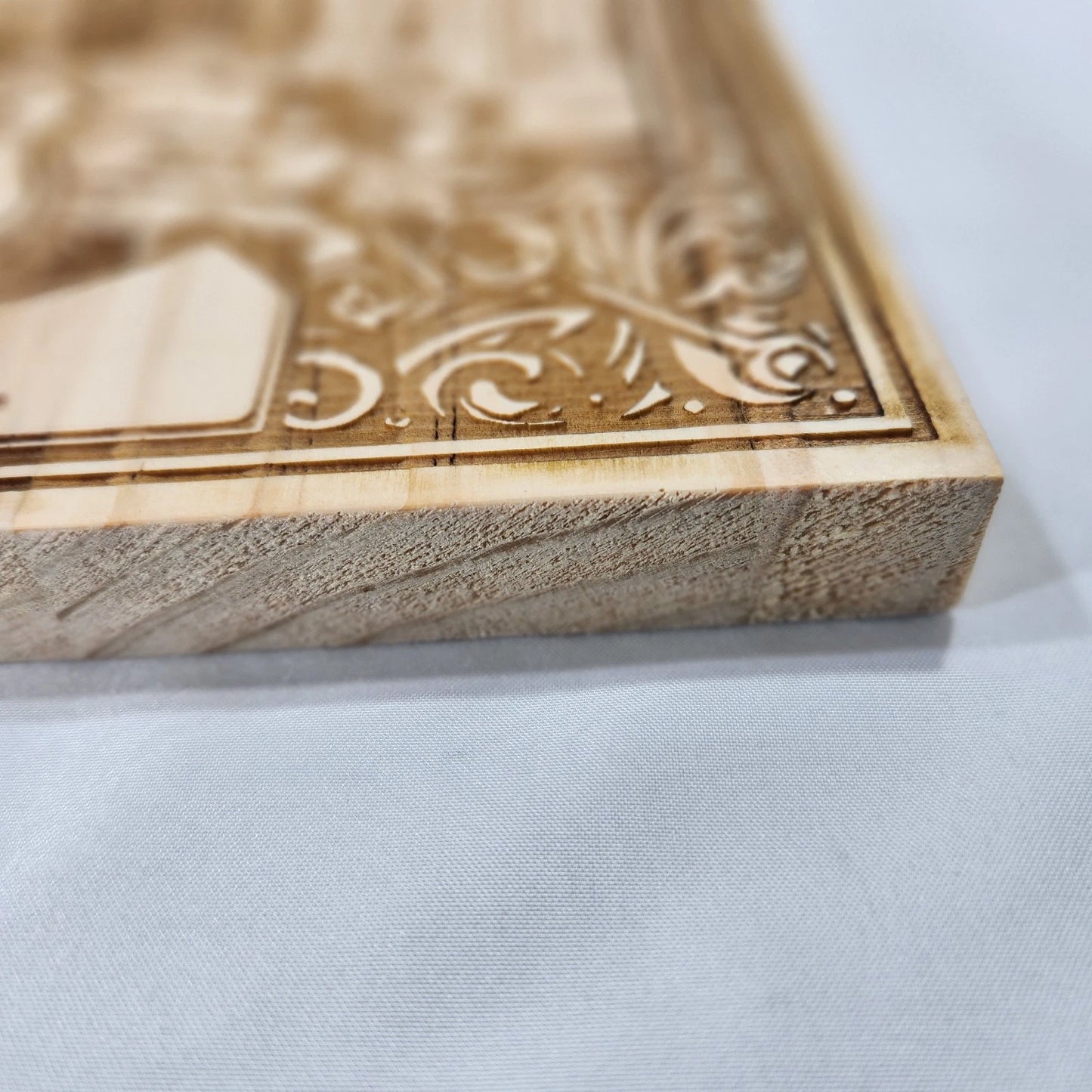 Close-up of Route 66 wood laser-engraved design