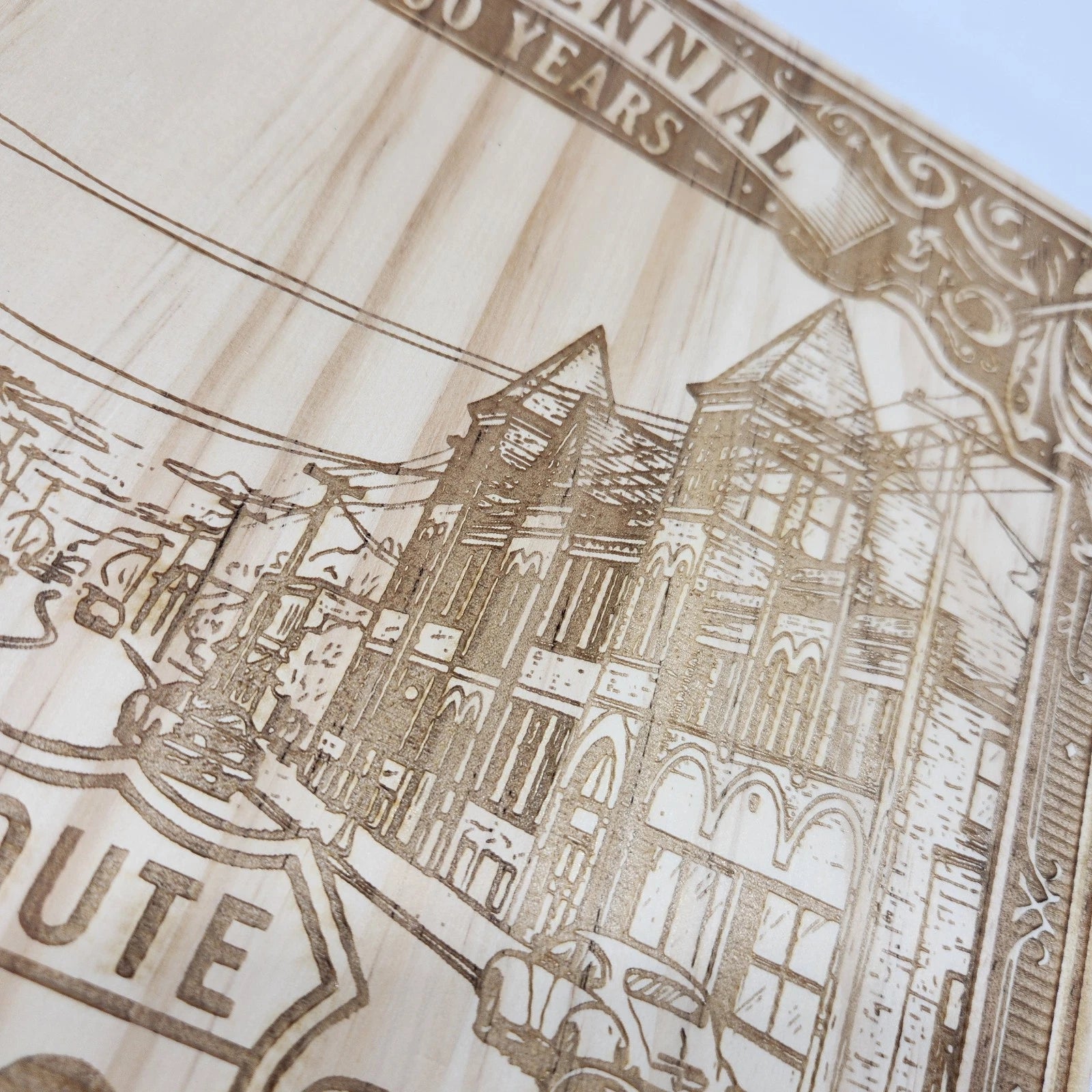Close-up of Route 66 wood laser-engraved design