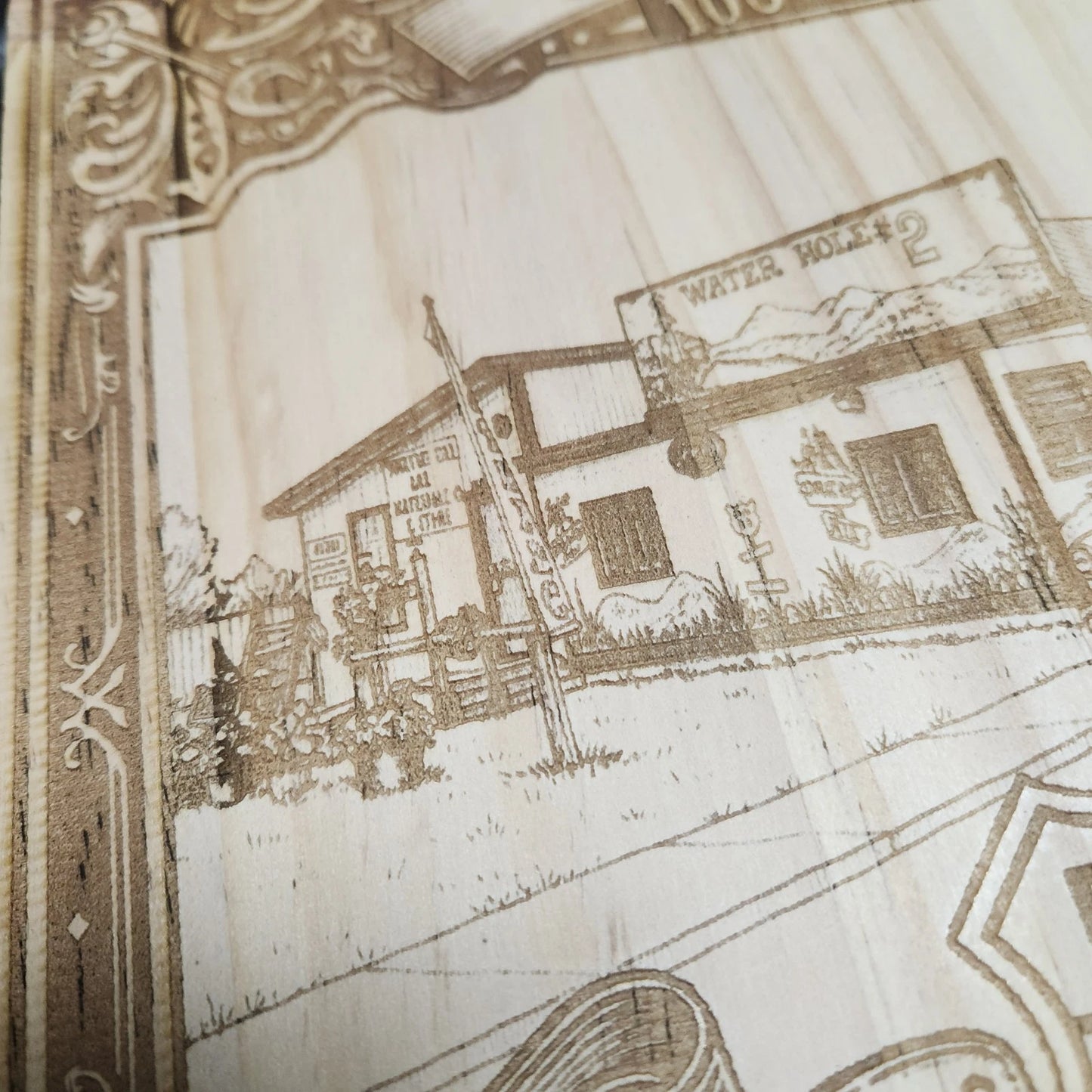 Close-up of Route 66 wood laser-engraved design