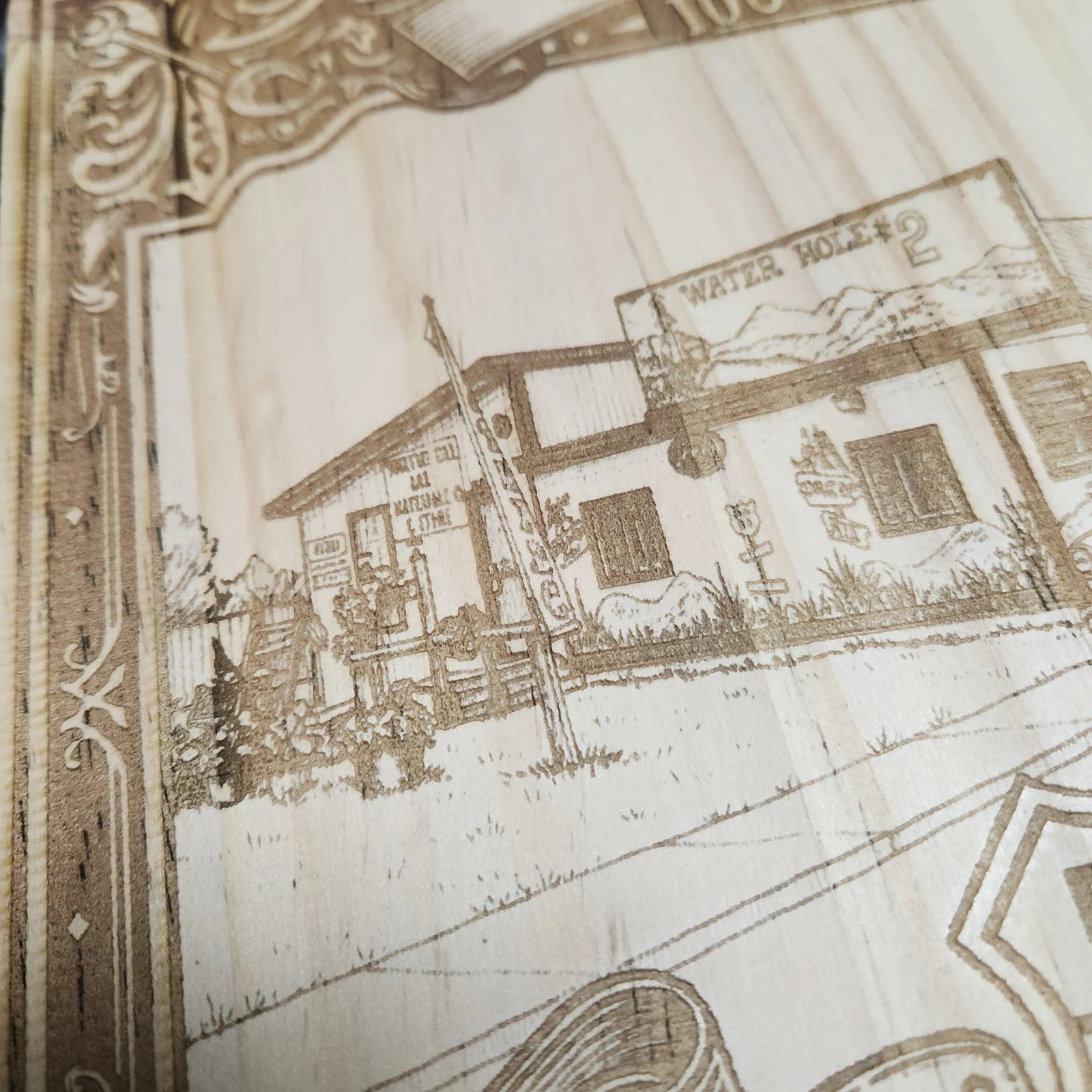 Close-up of Route 66 wood laser-engraved design