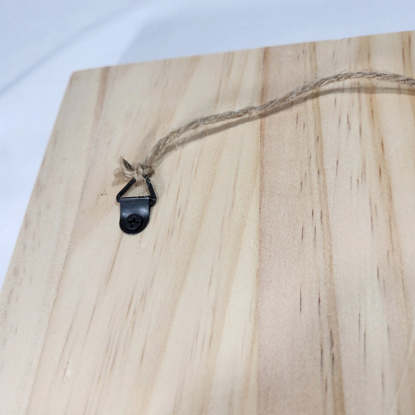 Close-up of Route 66 wood laser-engraved design backside string