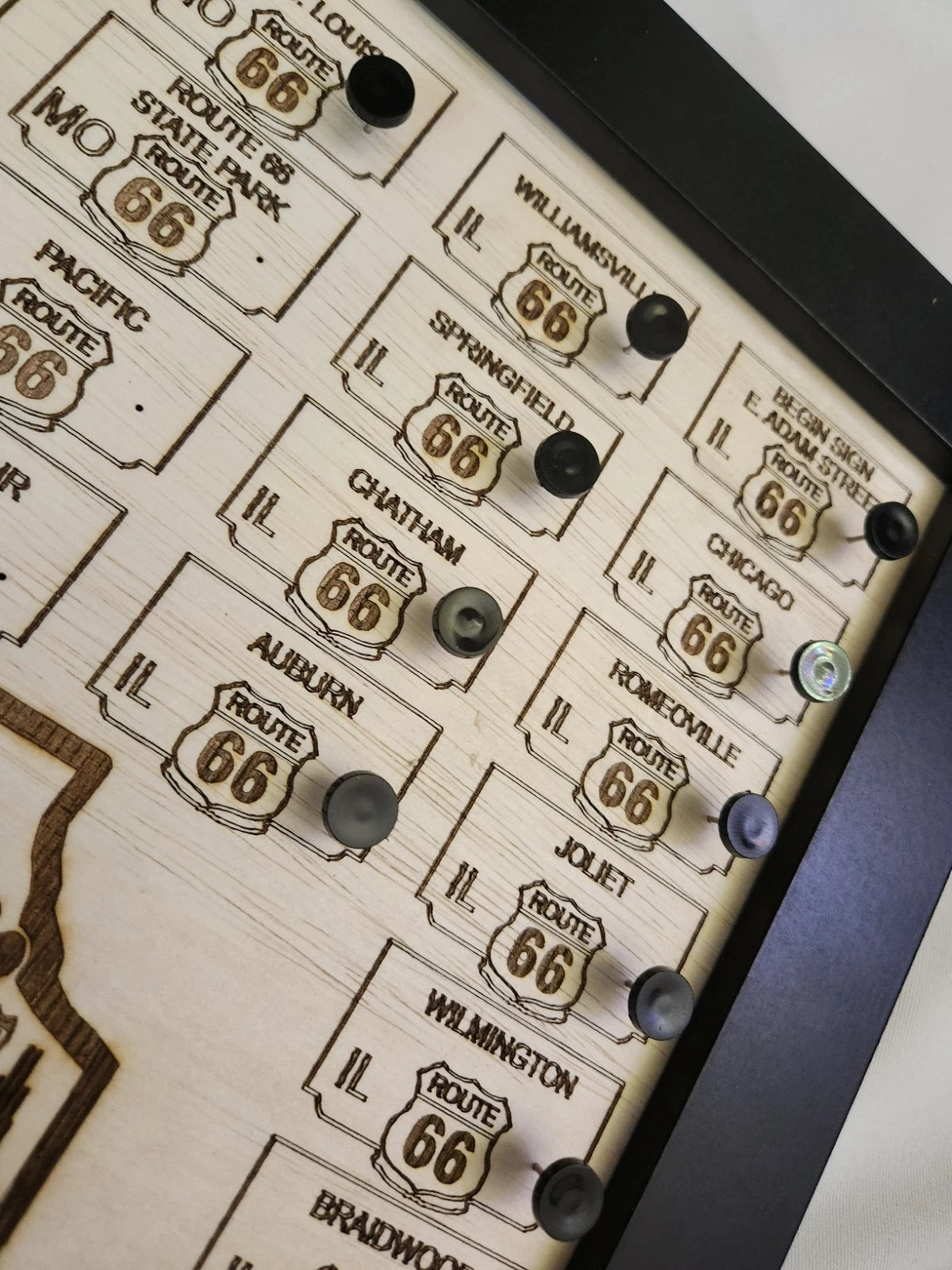 Map corner with engraved Route 66 signs