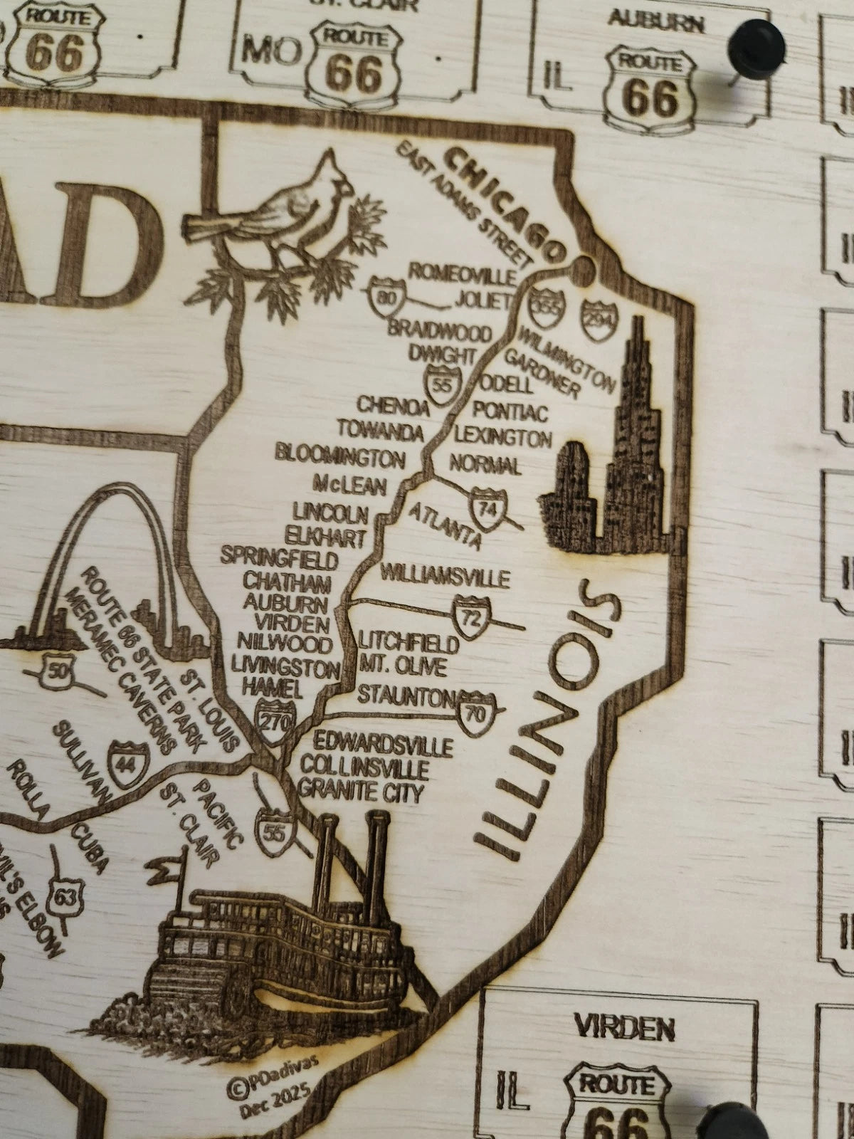 Close-up shot of Illinois map with laser-cut details and engraved text.