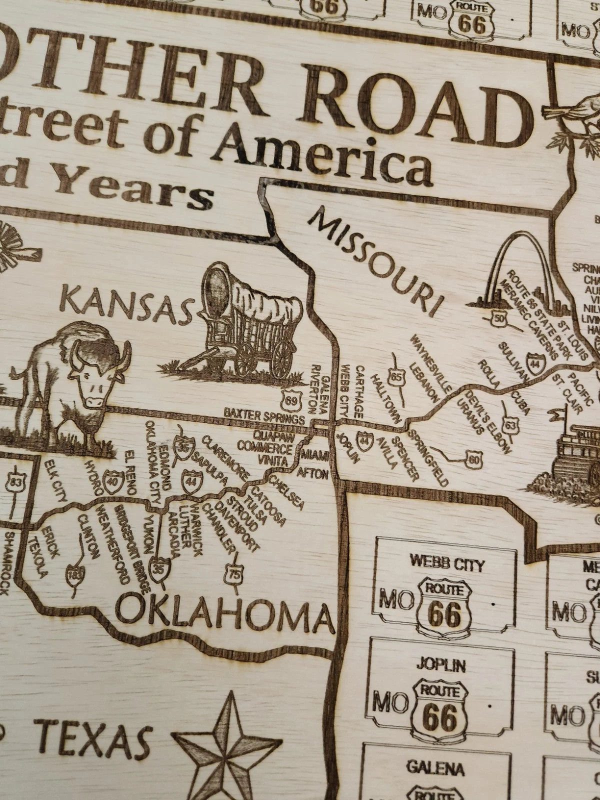 Close-up shot of Missouri, Kansas, and Oklahoma with laser-cut details and engraved text